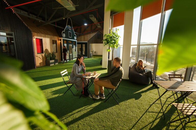 Green lounge area and cafe at new space Lviv office